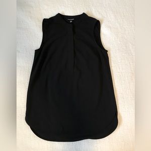Like new, black, half zip sleeveless blouse. Full coverage material. Versatile